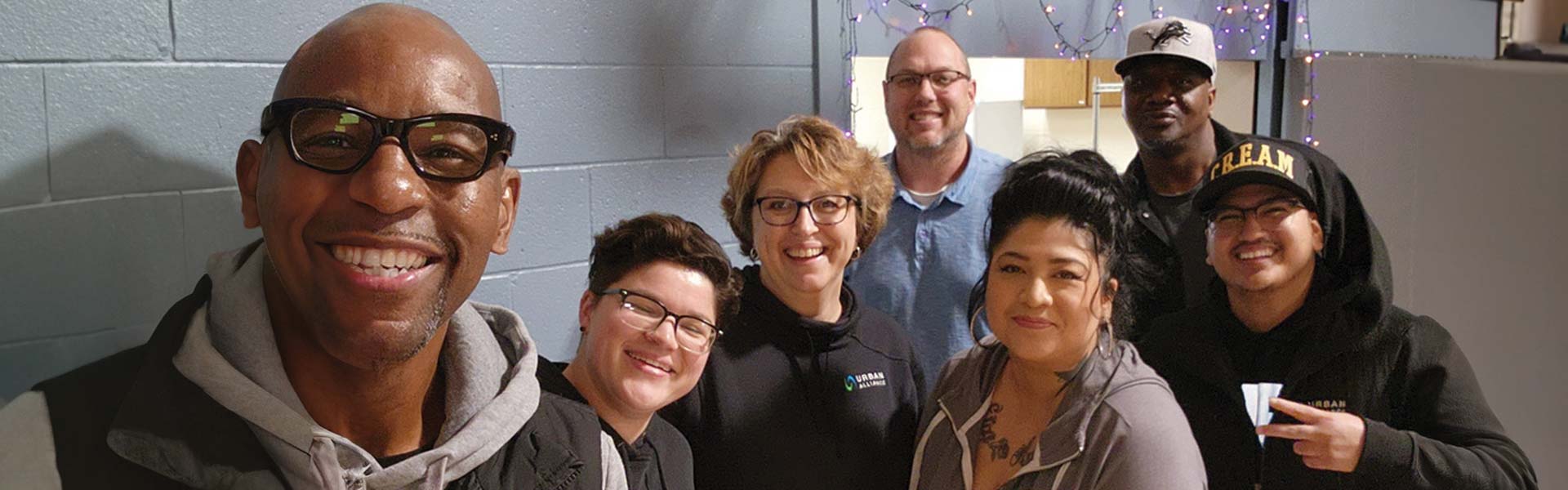 Urban Alliance team members pose together for a group selfie in the UA kitchen.