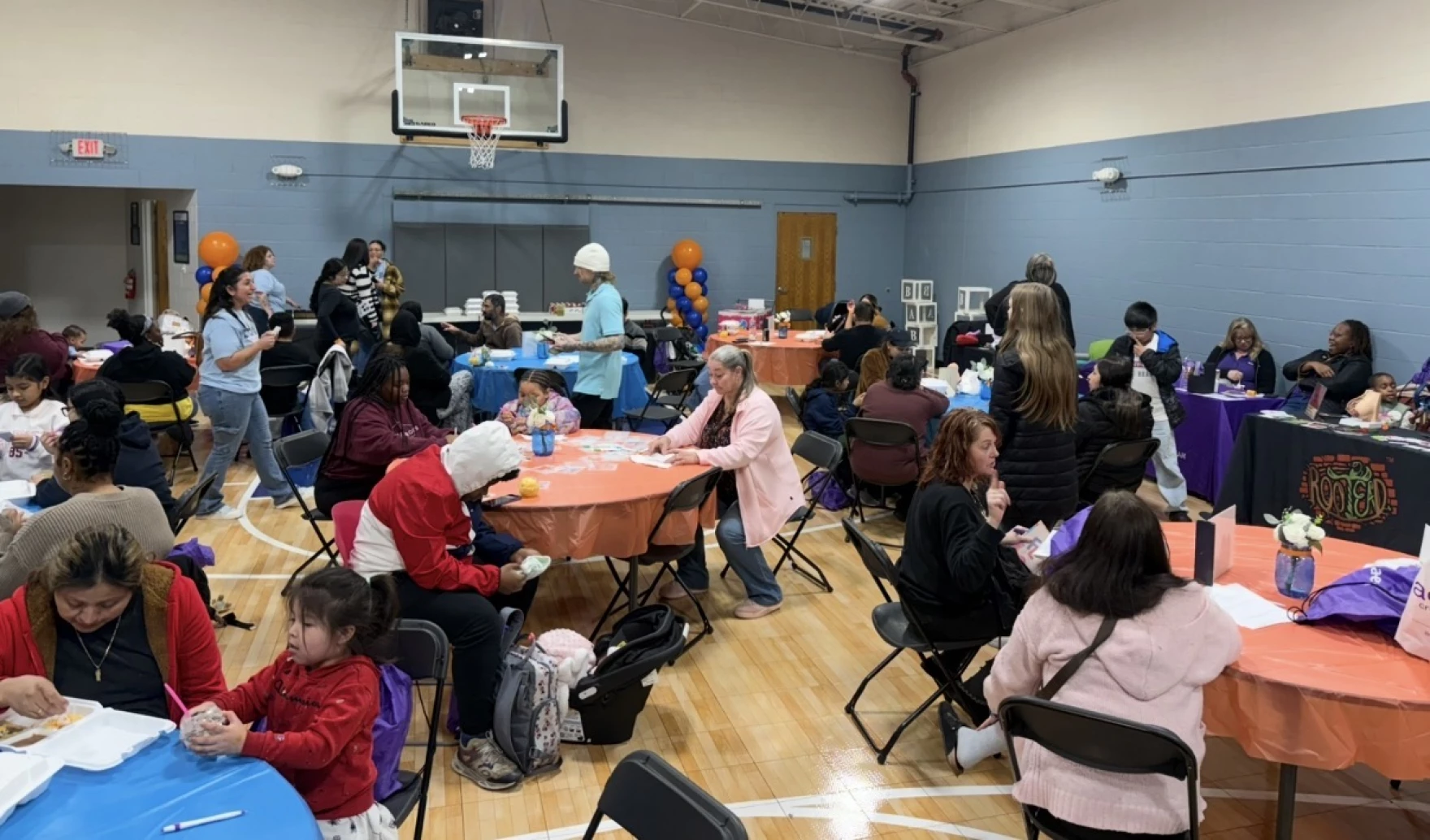 Families in Urban Alliance of Kalamazoo's gymnasium for Cradle Kalamazoo's free baby shower